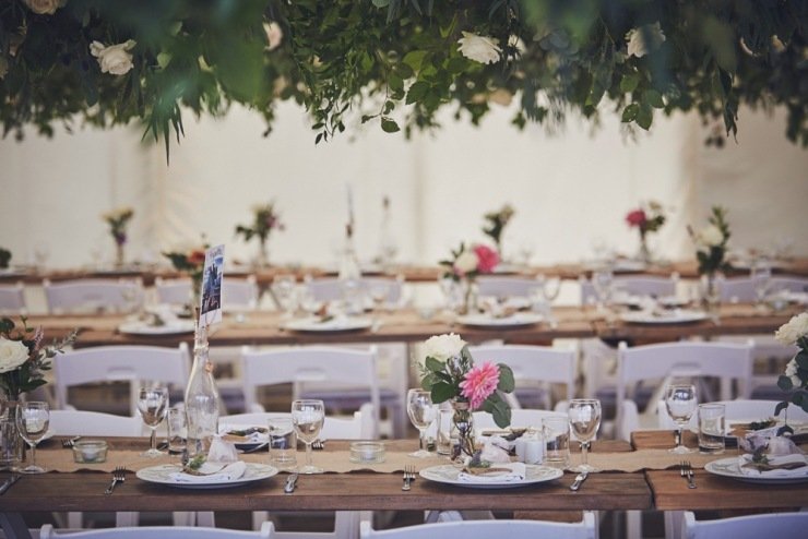 hanging roses and wedding styling in marquee in Devon