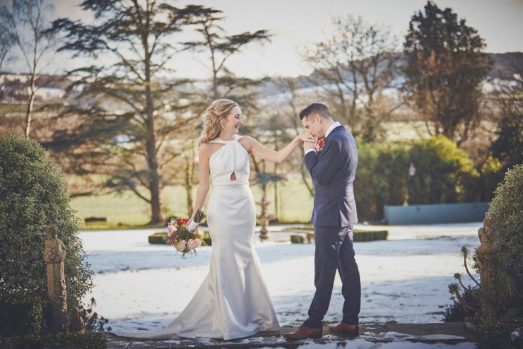 snowy winter wedding photography of bride and groom at wedding at deer park country house hotel in devon 