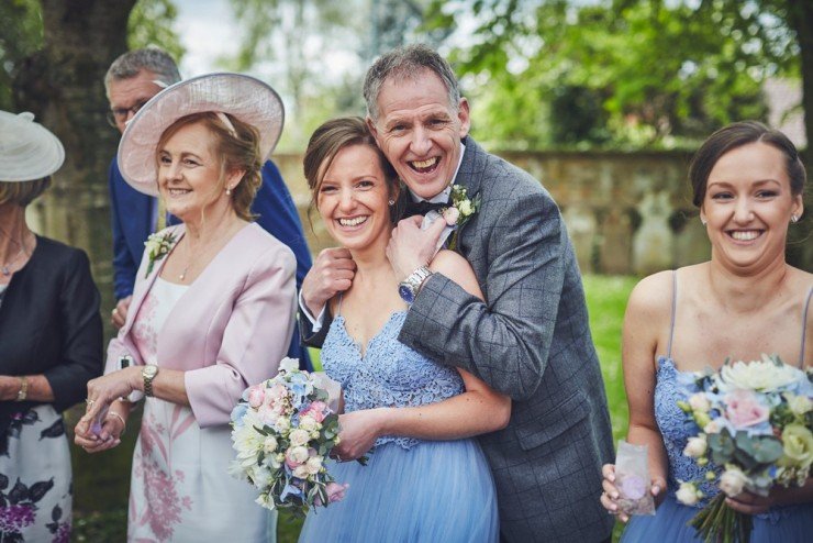 relaxed wedding photography of smiling guests at wedding in upton barn and walled garden devon