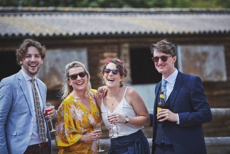 relaxed wedding photography at Upton Barn and walled garden showing guests laughing