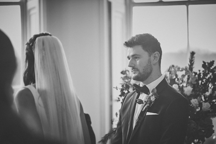 wedding photography of groom looking at his bride to be at small devon wedding