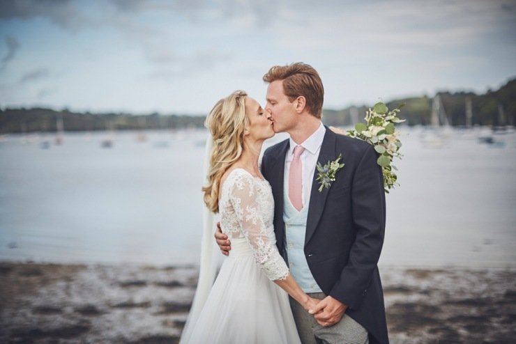 bride and groom laughing at marquee wedding Devon