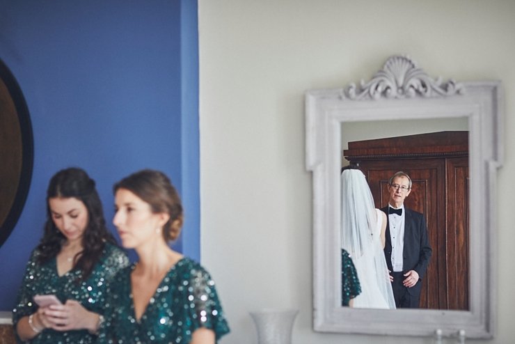 Dad looking at his daughter before the ceremony at a micro wedding at rockbeare manor devon
