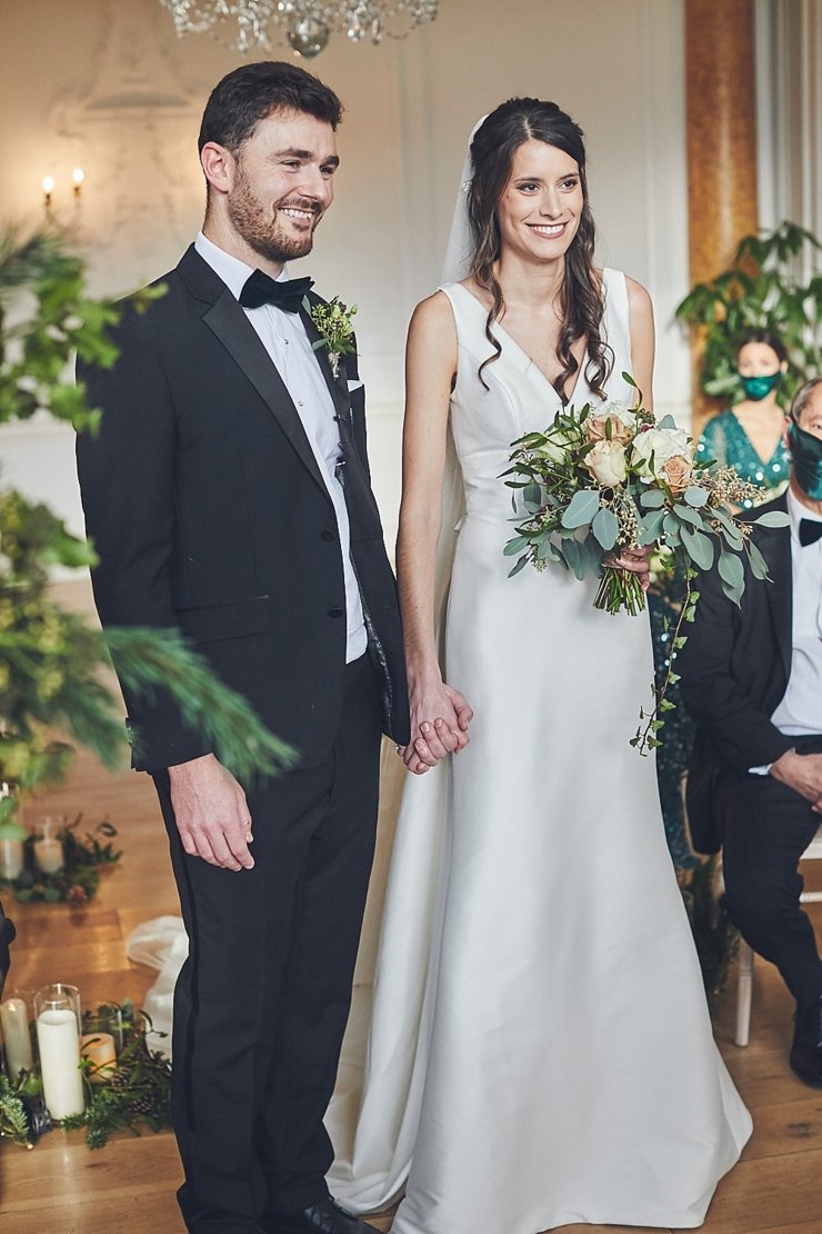 wedding photography of bride and groom smiling at small wedding at Rockbeare manor in Devon