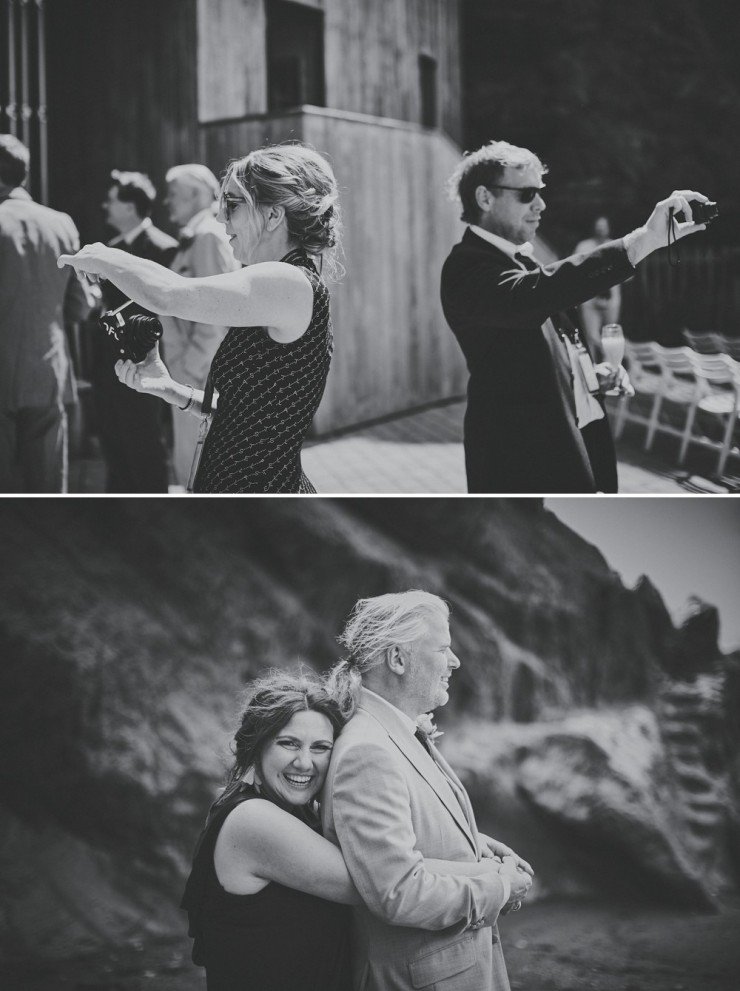 documentary wedding photography of wedding guests taking photos at tunnels beaches in devon