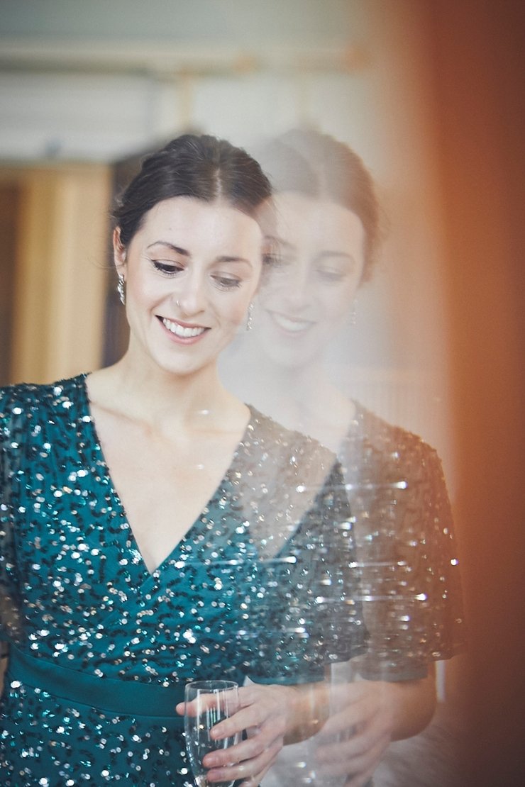 bridesmaid double reflection in vintage mirror at Rockbeare manor mini winter wedding
