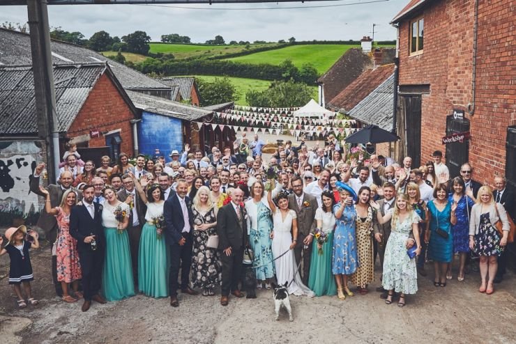photography of all the guests smiling at camera at Devon wedding at West Town Farm devon