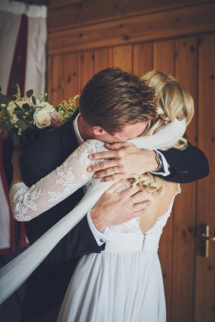 bride and groom emotional embrace after wedding ceremony in Devon