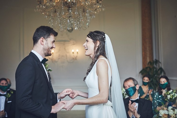 bride and groom laughing at small wedding at Rockbeare manor in Devon