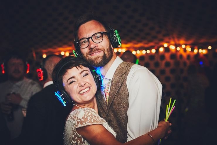 bride and groom's smiling at camera at silent disco at West Town Farm