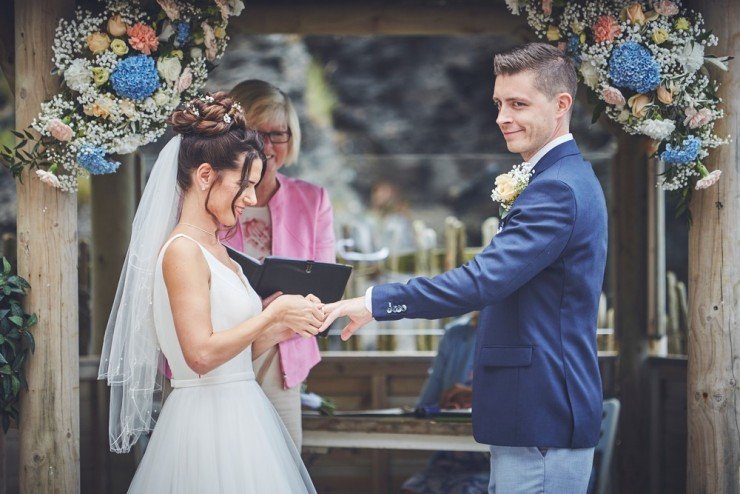 bride and groom during ceremony at tunnels beaches in devon