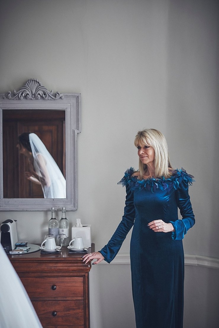 Mum looking proudly at her daughter at a mini wedding at Rockbeare manor Devon