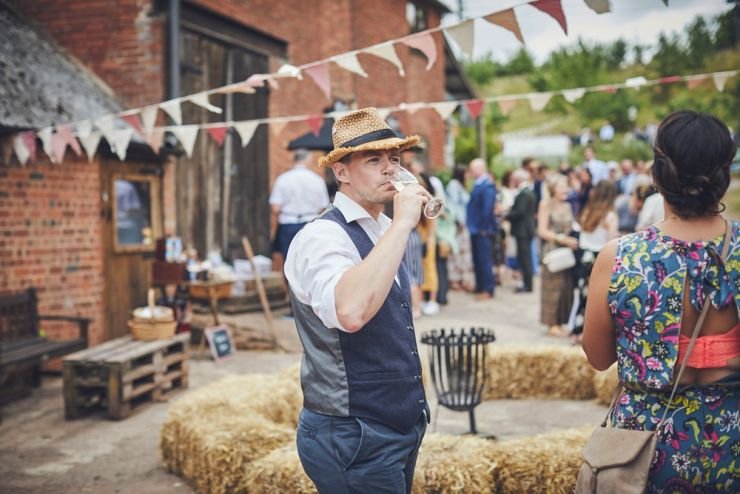 documentary wedding photograph of relaxed wedding guest at West Town Farm in Devon