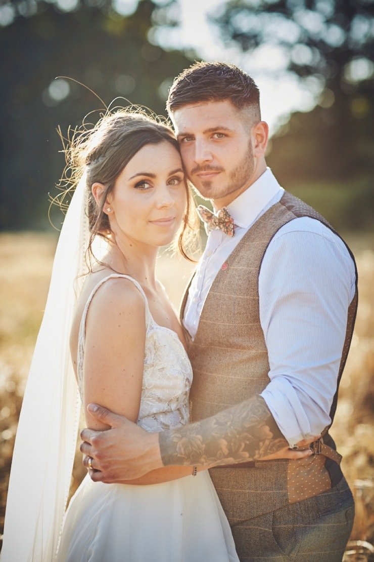couple in the cornfield at summer wedding in Devon wedding venue upton barn