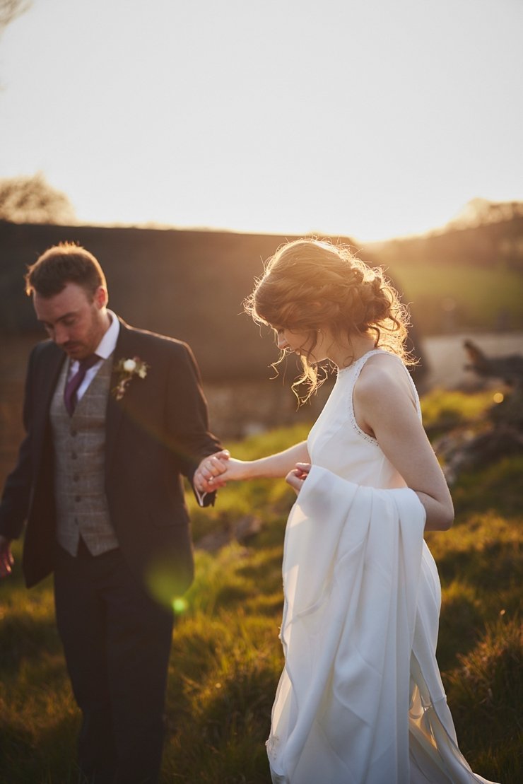 golden hour with bride and groom at the great barn Exeter