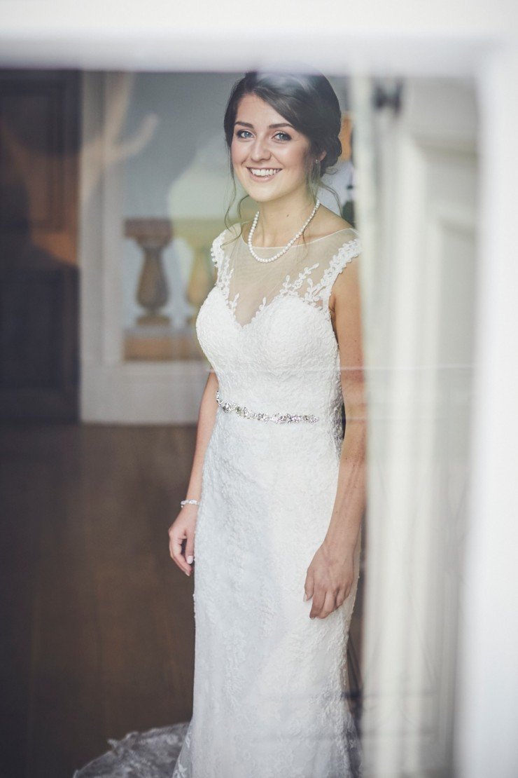 relaxed wedding photography of bride getting ready at a wedding at Rockbeare manor in Exeter devon