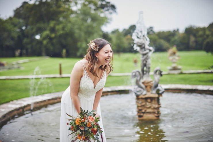 bride laughing at Rockbeare manor in Exeter