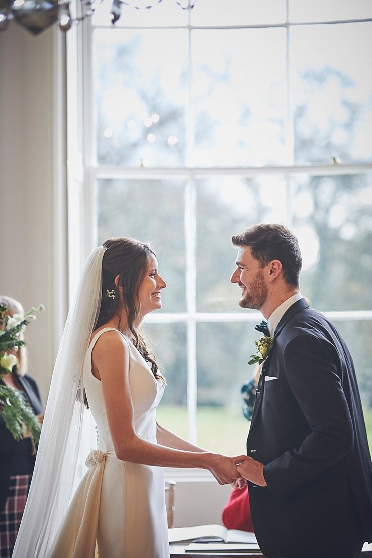 bride and groom during ceremony at small devon wedding