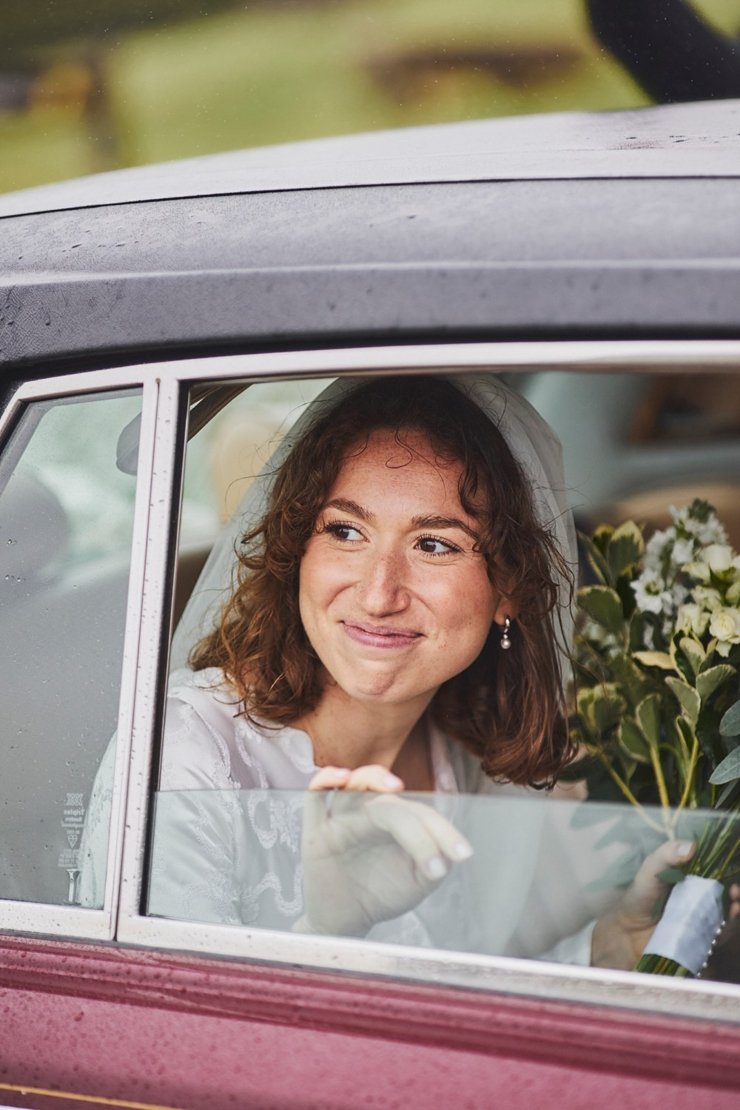 excited bride in car before ceremony in rhossili Wales