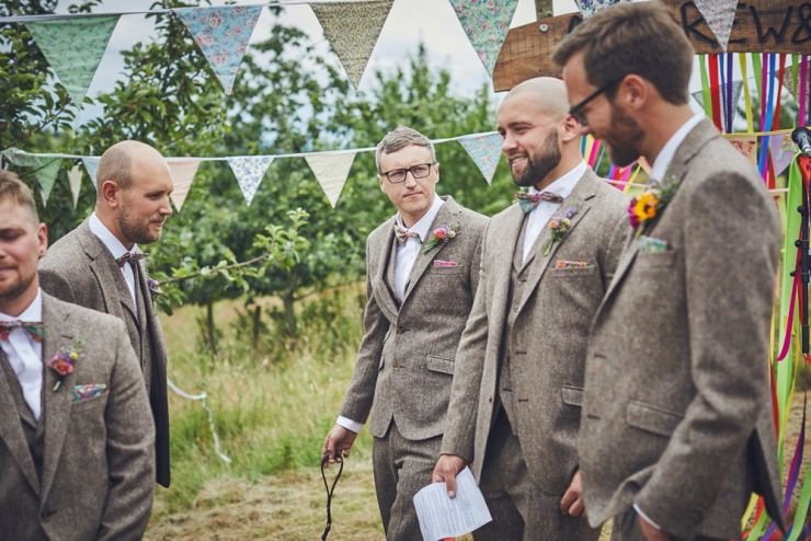 photography of the best men and ushers before the hand tying ceremony at West Town Farm barn 