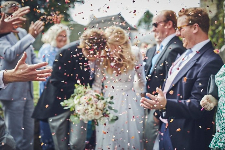 candid photography of confetti throw at Devon wedding
