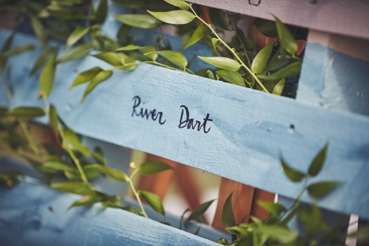 rustic ladder for table plan wedding styling in marquee in Devon