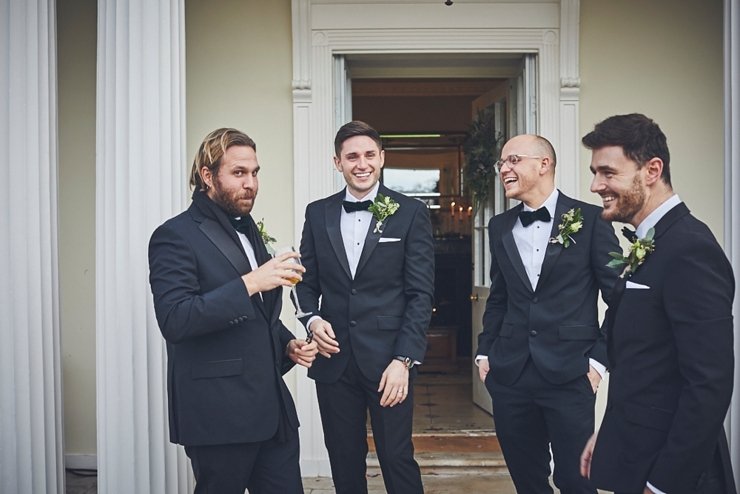 relaxed wedding photography of groomsmen at mini black tie wedding in Devon