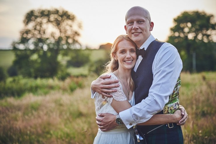smiling couple in golden hour wonwood barton Devon