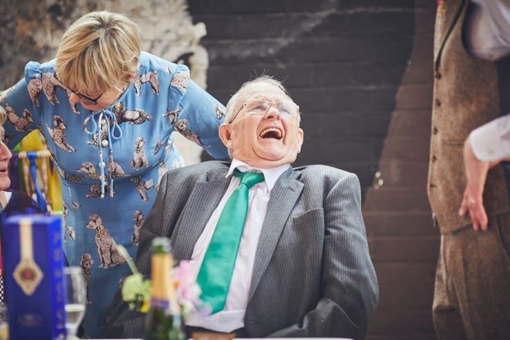 documentary wedding photography of guests laughing at a devon wedding