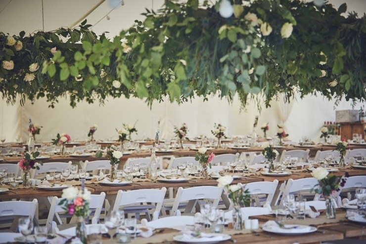hanging roses and wedding styling in marquee in Devon