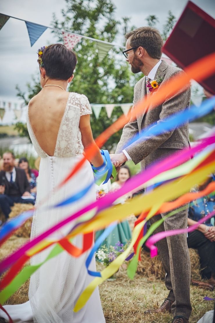 Hand tying ceremony at a wedding at West Town Farm in Exeter
