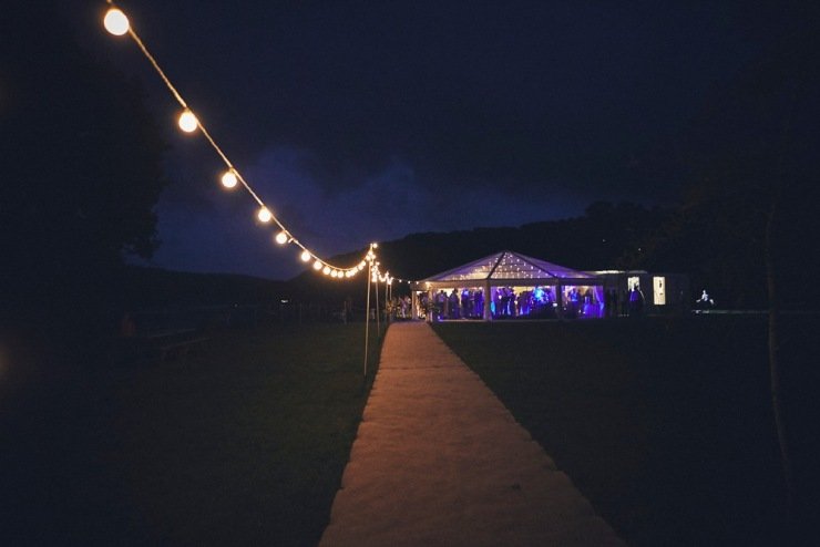night shot of party at marquee wedding in Devon