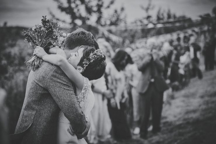 bride and groom embrace at West Town Farm barn wedding photography devon