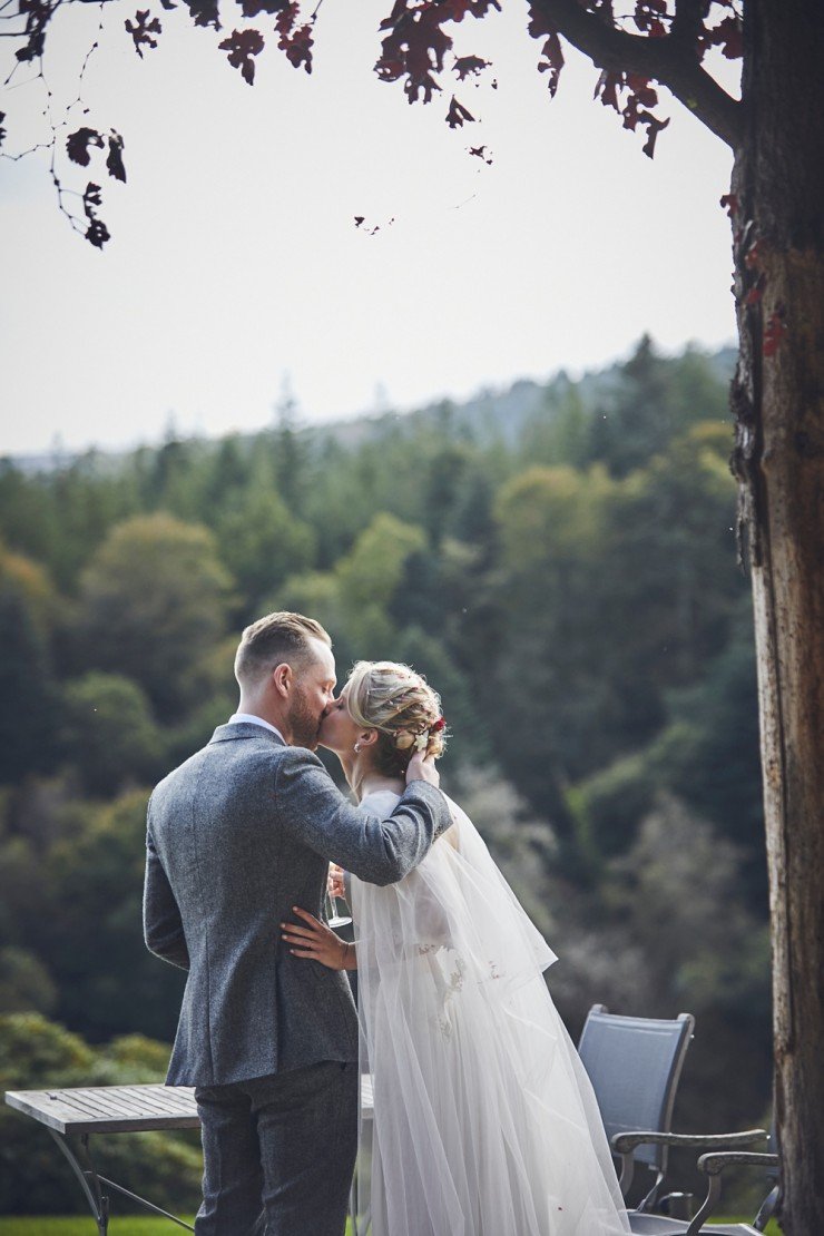 relaxed, creative wedding photographer takes portraits of bride and groom at their Autumn wedding at Hotel Endsleigh in Devon