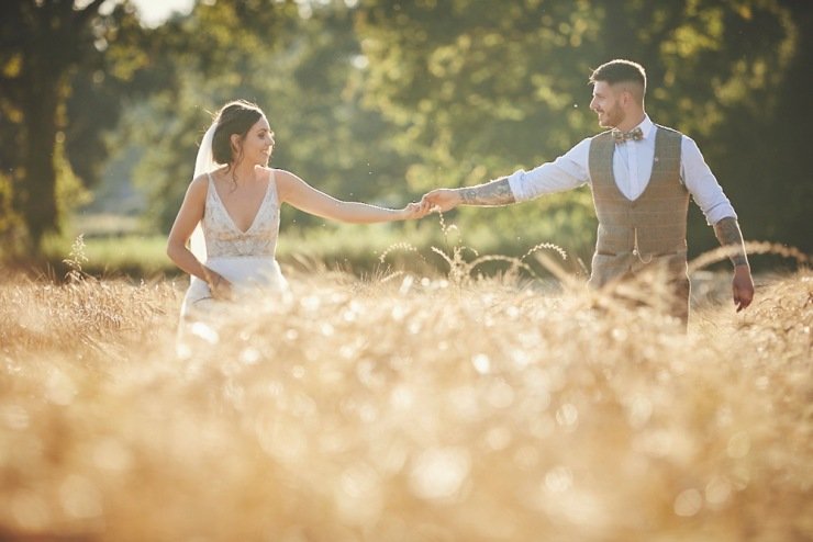 couple in the cornfield at summer wedding in Devon