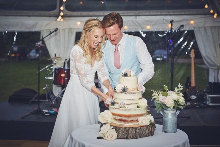 fun cake cutting at Devon wedding 