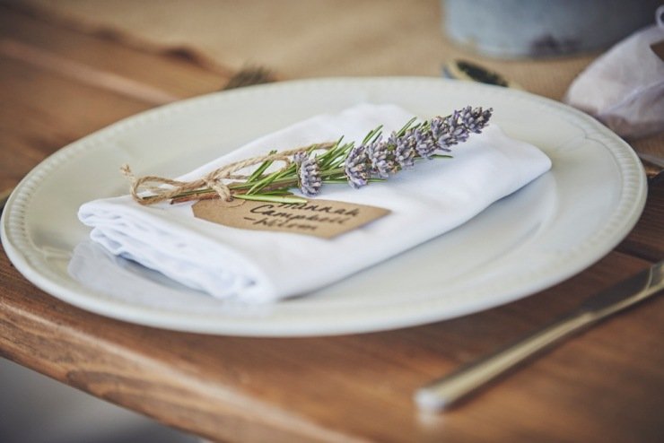 beautiful table styling and lavender place names in marquee in Devon