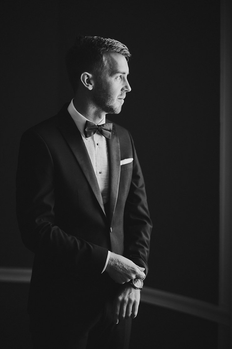 groom in black tie at Rockbeare Manor Devon