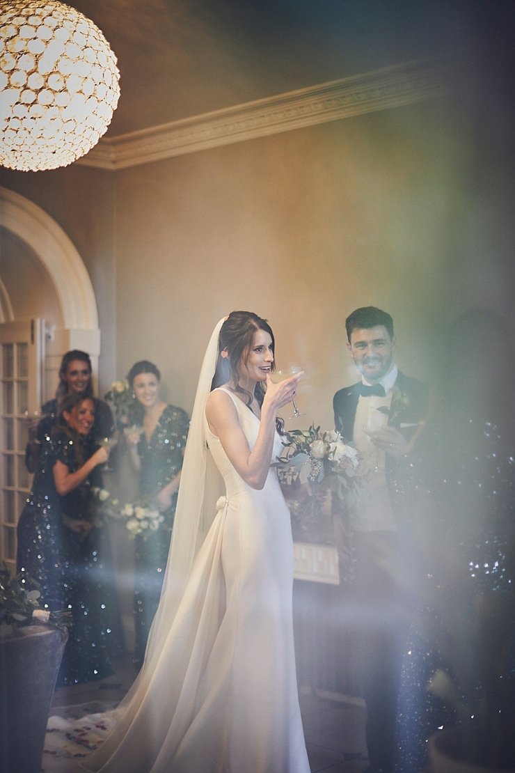 relaxed bride and groom  during drinks reception at Rockbeare Manor wedding