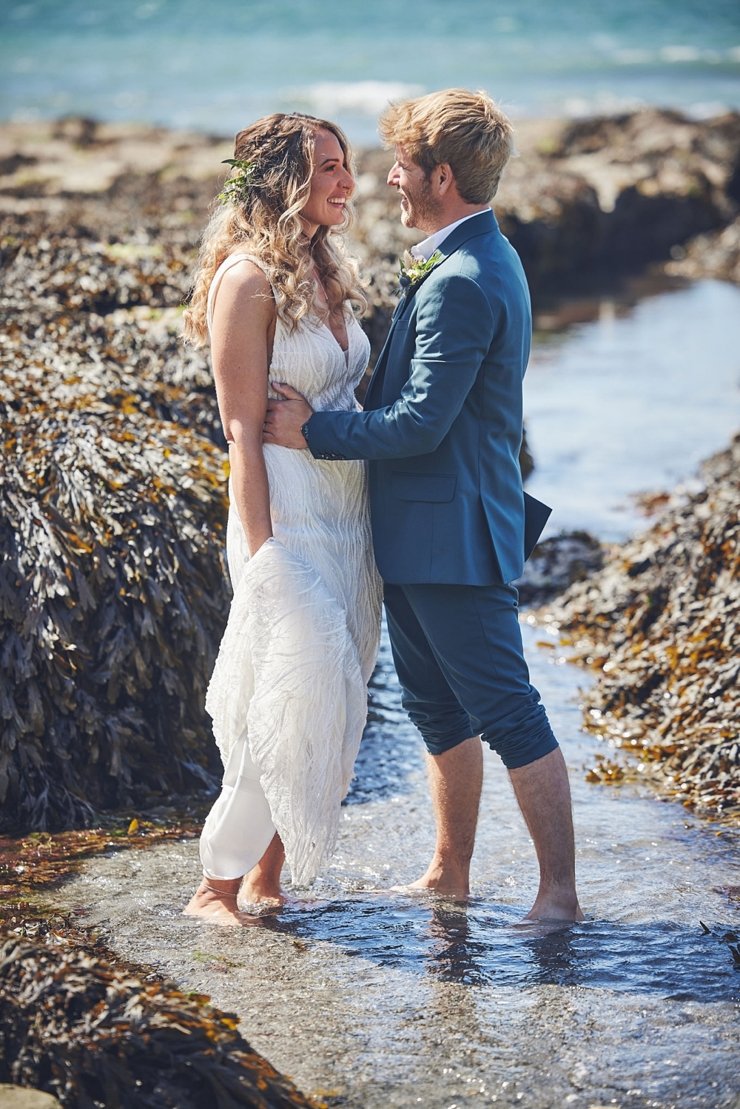 couple on beach at tunnels beaches
