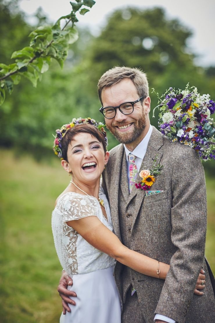 portrait of bride and groom laughing at a West Town Farm wedding in devon
