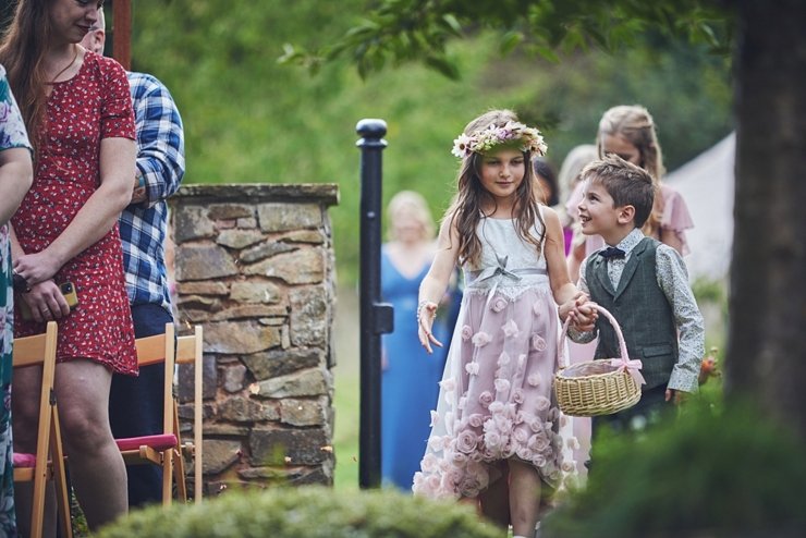 candid of flower girl and page boy at church wedding in Devon