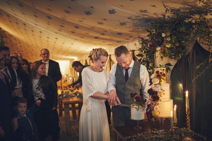 stunning wedding cake being cake cut at Hotel Endsleigh in Devon