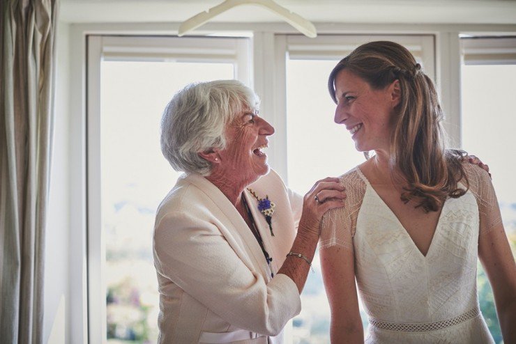 mum and daughter look at each other smiling at South Hams wedding preps