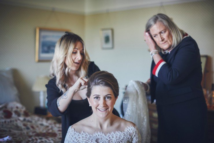 preps photo of putting brides veil at Devon wedding.jpg