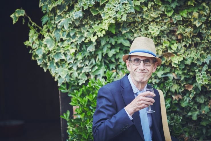candid portrait wedding photography of guest smiling at camera at a wedding at a West Town Farm devon