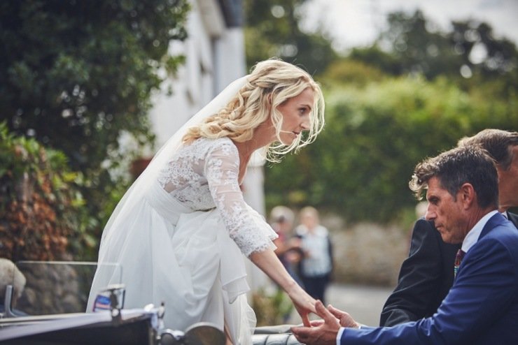 reportage wedding photography of brides arrival to the church in Devon
