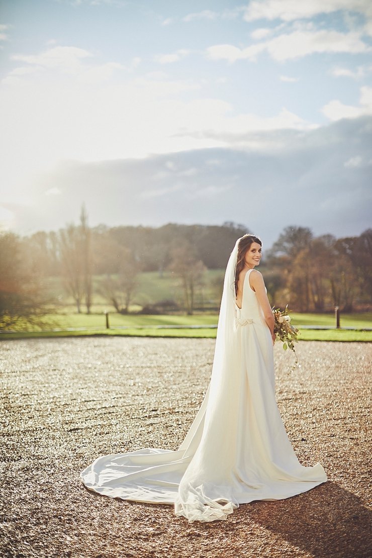 portrait of happy bride at small winter wedding at Rockbeare manor in Devon