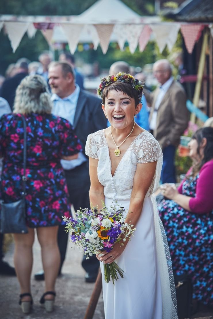 fun wedding photography of bride laughing at Devon wedding