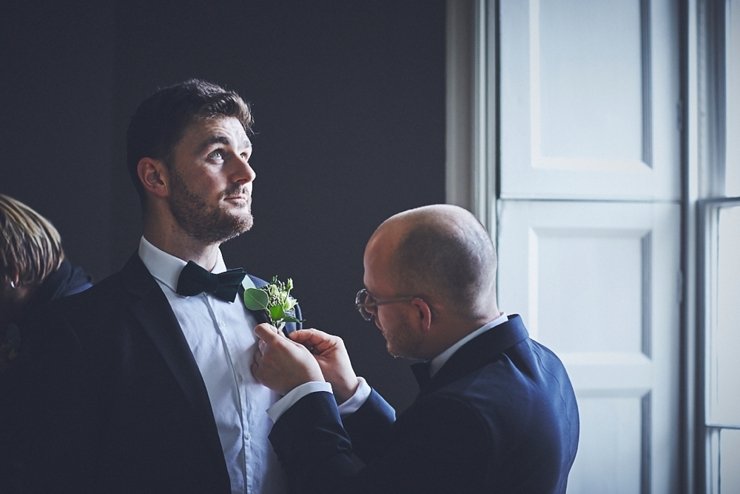 groom getting ready at intimate wedding at Rockbeare manor in Devon